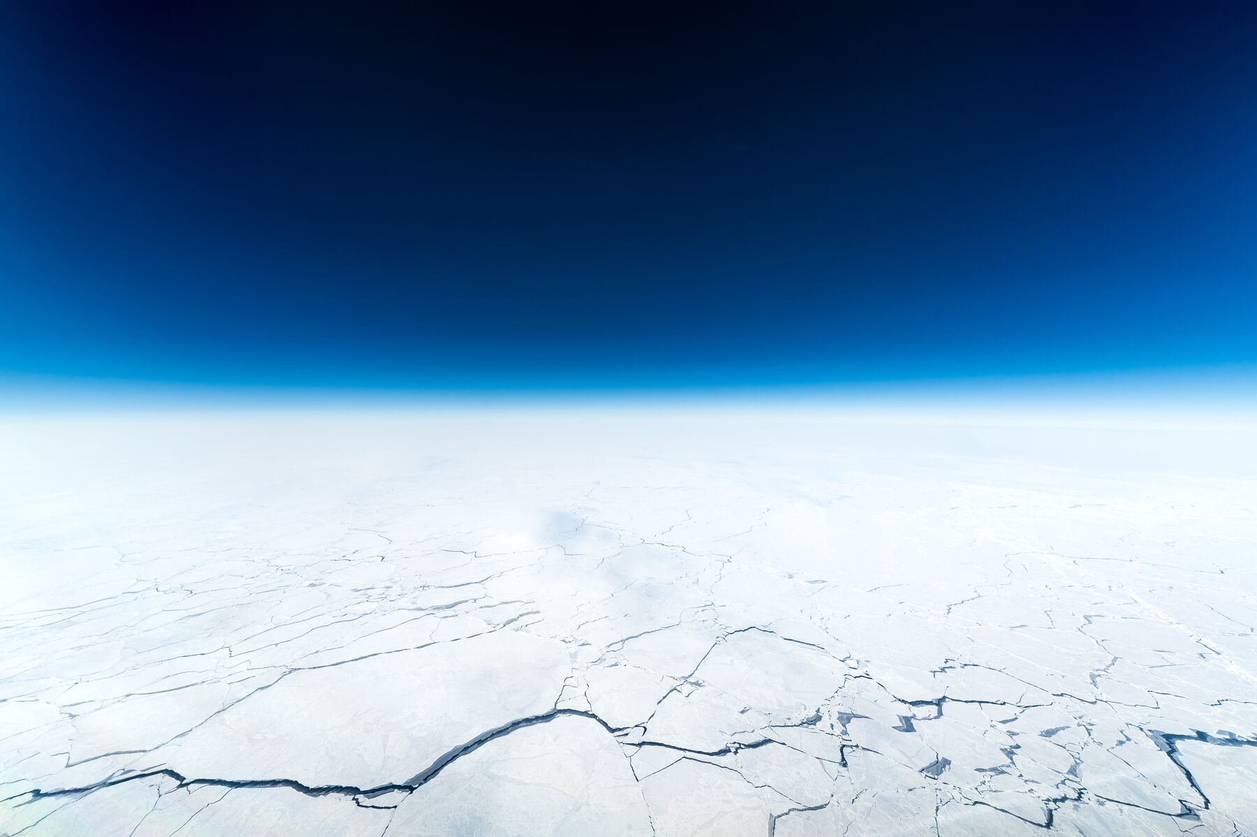 Aerial view of remote runway and ice fields